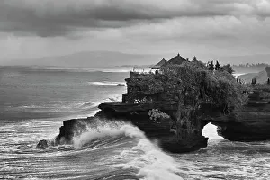 Images Dated 5th January 2023: Crashing waves on the lava rock shoreline of Tanah Lot Temple, Bali, Indonesia