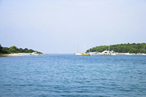 Gulf Prints: Cres, Coatia - Boats floating in an ocean inlet. Horizontal shot