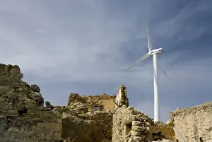 Turbine Prints: Crete. Greece. Europe. Wind turbine of Plastika Kritis wind farm towers above ruins