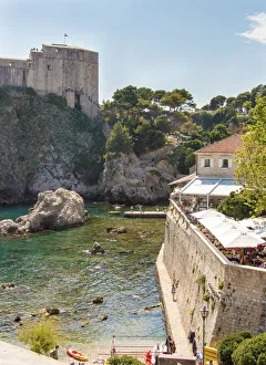 Dalmatia Prints: Croatia, Dubrovnik. Restaurant outside walled old city. St. Lawrence Fort