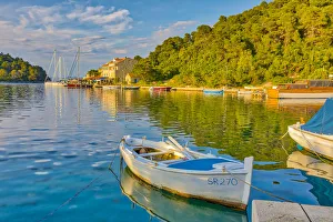 Images Dated 9th May 2018: Croatia, Pomena. Sunset on harbor and Island of Miljet