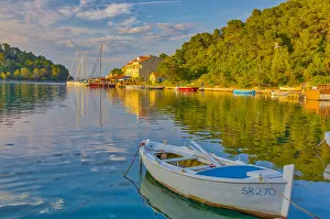 Images Dated 9th May 2018: Croatia, Pomena. Sunset on harbor and Island of Miljet