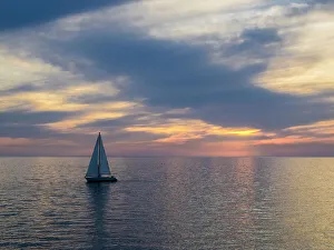 Serenity Prints: Croatia, Rovinj, Istria. Sailing boat on the Adriatic Sea outside the harbor of Rovinj at sunset