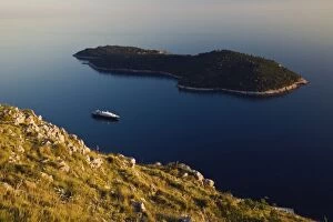 Cruise ship in the Adriatic Sea approaching the historic harbor of Dubrovnik, Croatia