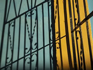 Caribbean Gallery: Cuba, Camaguey, UNESCO World Heritage Site, wrought iron gate and colorful walls