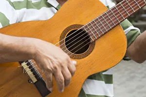 Person Prints: Cuba, Havana. Close-in of man playing guitar