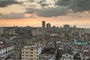 Socialist Prints: Cuba, Havana, elevated city view above Central Havana looking west, dusk