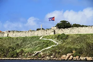 Havana Prints: Cuba, Havana. Fortress wall and Cuban flag at San Carlos de la Cabana fortress in
