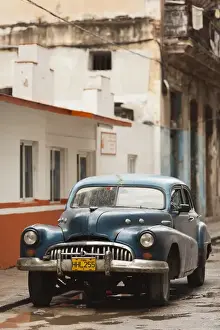 Images Dated 4th March 2012: Cuba, Havana, Havana Vieja, morning view of Old Havana street with 1950s-era US car