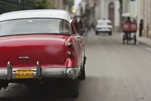 Images Dated 4th March 2012: Cuba, Havana, Havana Vieja, morning view of Old Havana street with 1950s-era US car