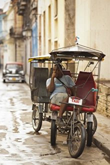 Communist Prints: Cuba, Havana, Havana Vieja, pedal taxi with driver, NR