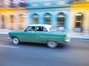 Prints of Cuba, Havana, Havana Vieja, UNESCO World Heritage Site, classic car in motion Caribbean Prints: Cuba, Havana, Havana Vieja, UNESCO World Heritage Site, classic car in motion