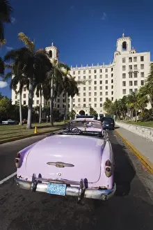 Images Dated 3rd March 2012: Cuba, Havana, Vedado, Hotel Nacional and 1950s-era US car, late afternoon