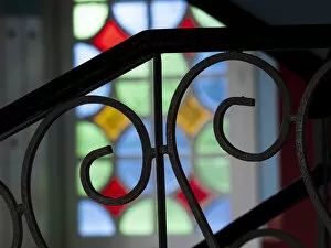 Cuba, Vinales, wrought iron railing and stained glass window