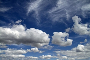 Puffy Prints: Cumulus and cirrus clouds with blue sky over Idaho, USA