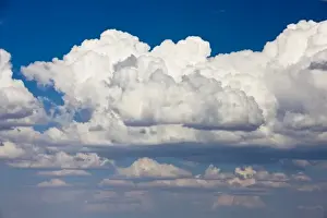 Atmosphere Prints: Cumulus clouds extend into the distance above Utah mountains in the southwest