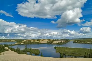 Cumulus clouds float above lakes, Northwest Territories, Canada