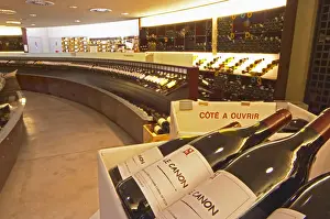 Seller Prints: A curved display of bottles. In the foreground bottles of Le Canon SARL La Grande