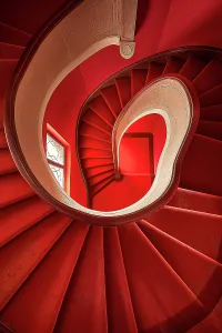 View From Above Prints: Curved stairway with window and carpet. (AI Generated)