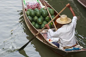 Images Dated 6th October 2021: Damnoen Saduak Floating Market, Bangkok, Thailand. Man with a boatload of watermelons for