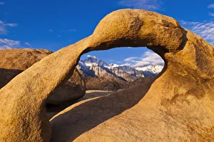 Sierra Prints: Dawn light on Mount Whitney through rock arch, Alabama Hills, Sequoia National Park