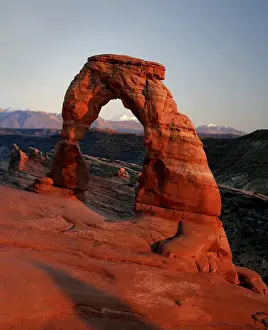 Images Dated 26th February 2008: Delicate Arch at Sunset with snow covered La Sal mountains in the background