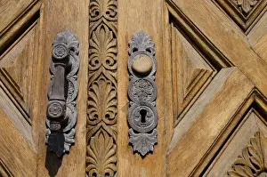 Denmark, Helsingoer. Ornate wooden door of the Helsingoer Kommune Radhus building