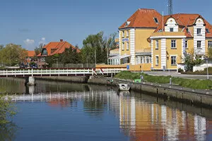 Denmark, Jutland, Grenaa, buildings along canal