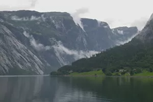 departing clouds bend and twist over the dramatic landscape of Eidfjord