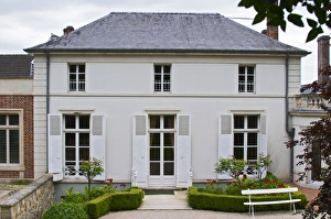 Champagne Prints: The Deutz building seen from the garden behind the main house with red roses