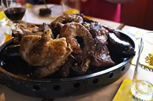 A dish of typical Uruguay barbecue with chicken, pork, beef, sausages, sweetbread