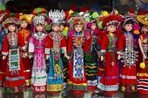 Kunming Prints: Dolls on display in Ethnic Native Dress, Kunming Ethnic Minorities Villiage Park, China