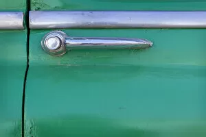 Detail of door handle on classic green car in Trinidad, Cuba