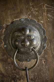 Yunnan Prints: Door knocker design, Naxi -temple, Lijiang. V