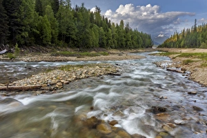 Doris Creek runs into Hungry Horse Reservoir with Flathead Range in background in