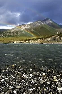 A double rainbow arches over the Kongakut river landcapse - Arctic National Wildlife