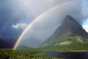 A double rainbow hangs over Grinnel Point in Glacier National Park, in Montana, USA