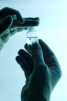 Images Dated 19th June 2007: Dr. John McLean collecting mosquitos in alcohol, attracting them using black light