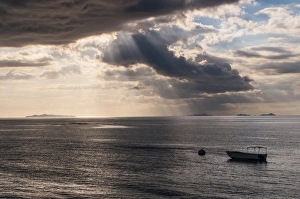 Scenics Prints: Dramatic light over a little boat, Mamanucas islands, Fiji, South Pacific