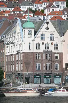 In the back drop of Bryggens ancient buildings Bergens harbor offers tours