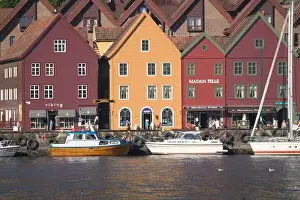 Images Dated 6th December 2005: In the back drop of Bryggens ancient buildings Bergens harbor offers tours