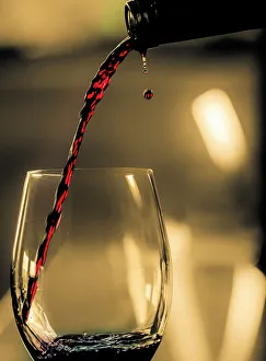 Glass Prints: One drop shows as red wine is poured into glass