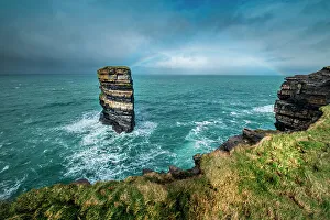 Rainbow Prints: Dun Briste Sea Stack resists the onslaught of the stormy Atlantic Ocean