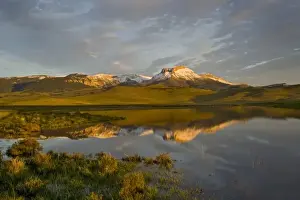 Ear Mountain reflcts into calm Lake Theboe along the Rocky Mountain Front in Montana