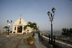 Images Dated 13th July 2007: Ecuador, Guayaquil. Atop the hill of Las PeA as, a Catholic church sits across from a lighthouse