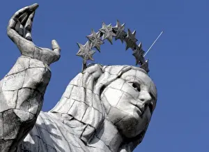 Ecuador, Quito. The Virgin of Panecillo watches over the capitol of Ecuador against a blue sky