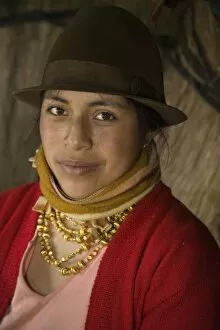 Ecuador, Zumbahua, woman in thatched hut. (MR)