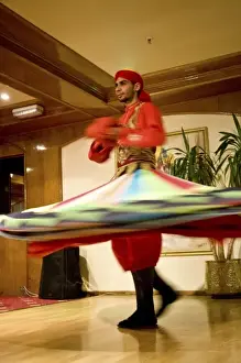 Images Dated 23rd January 2009: Egypt, Cairo. Whirling dervish dazzling GCT audience on Nubian Night aboard MS River