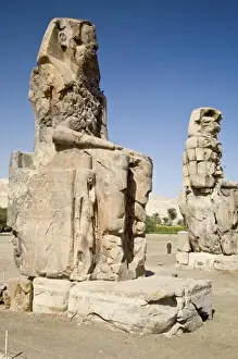 Thebes Prints: Egypt, Thebes. The six-story-high faceless Colossi of Memnon were badly damaged by