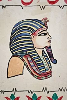 Egyptian figures drawn on souvenir shop wall, Luxor, Egypt